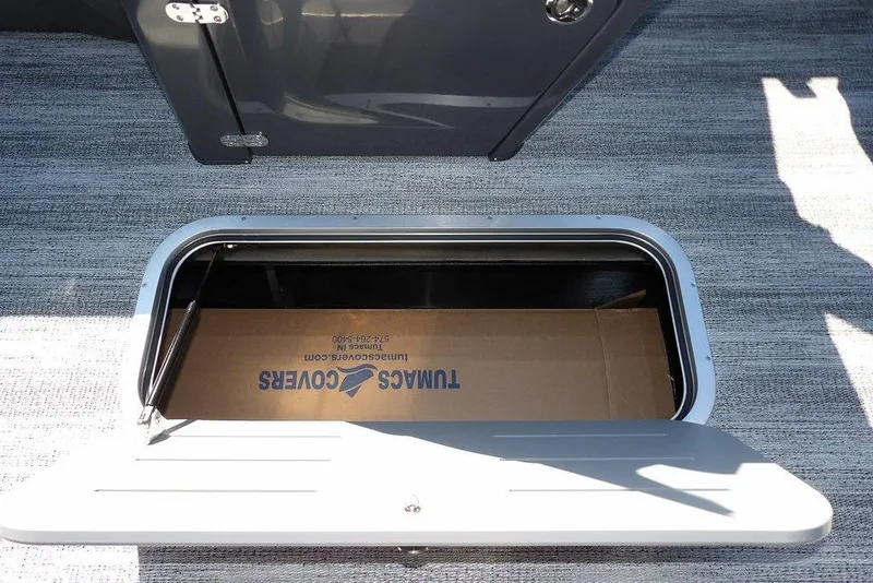 Slide: The Image of Storage compartment on 2026 Bennington S Swingback 22 SSB boat, featuring durable flooring. - 23
