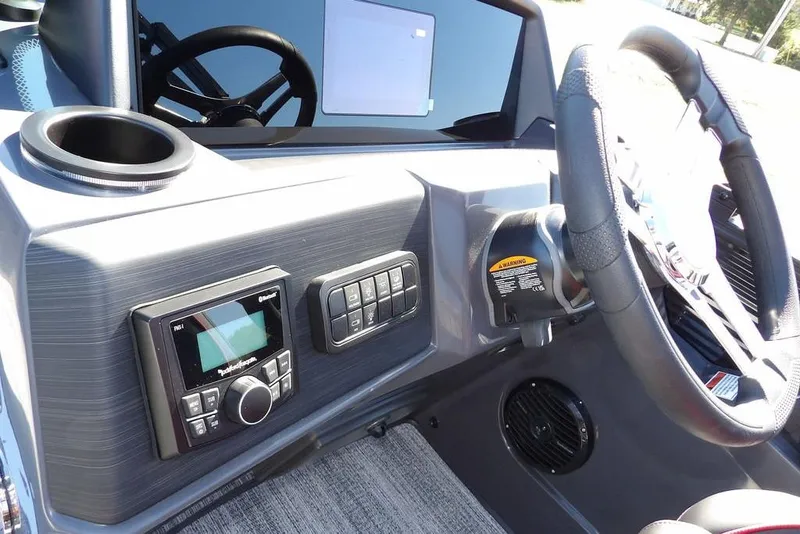 Slide: The Image of 2026 Bennington S Swingback 22 SSB dashboard with steering wheel and control panel. - 24
