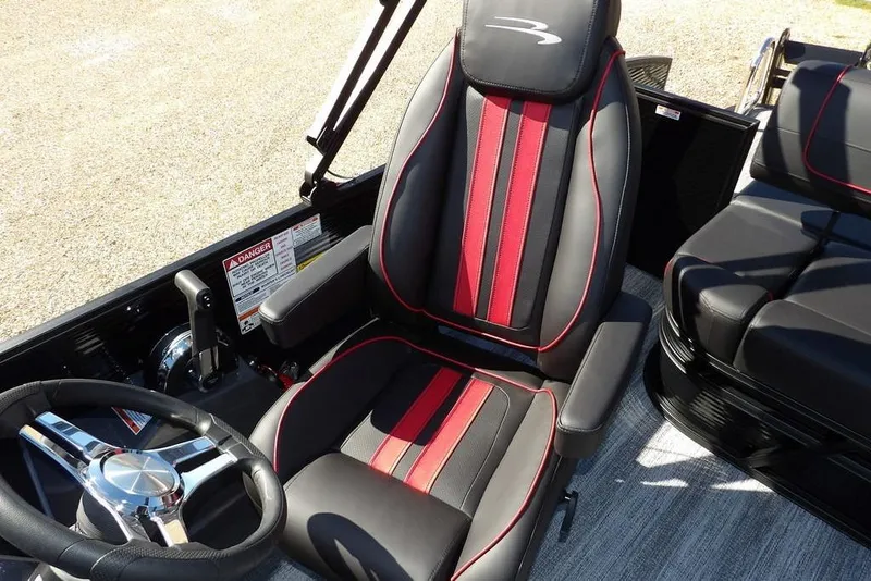 Slide: The Image of 2026 Bennington S Swingback 22 SSB interior with stylish red and black seating. - 26