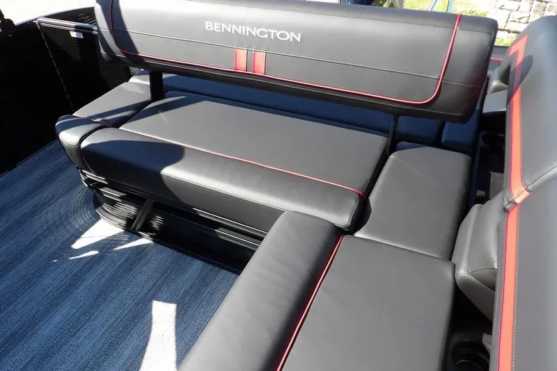 Slide: The Image of 2026 Bennington S Swingback 22 SSB boat seating with sleek black and red upholstery. - 28