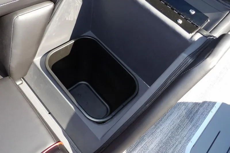 Slide: The Image of 2026 Bennington S Swingback 22 SSB storage compartment with sleek black interior design. - 29