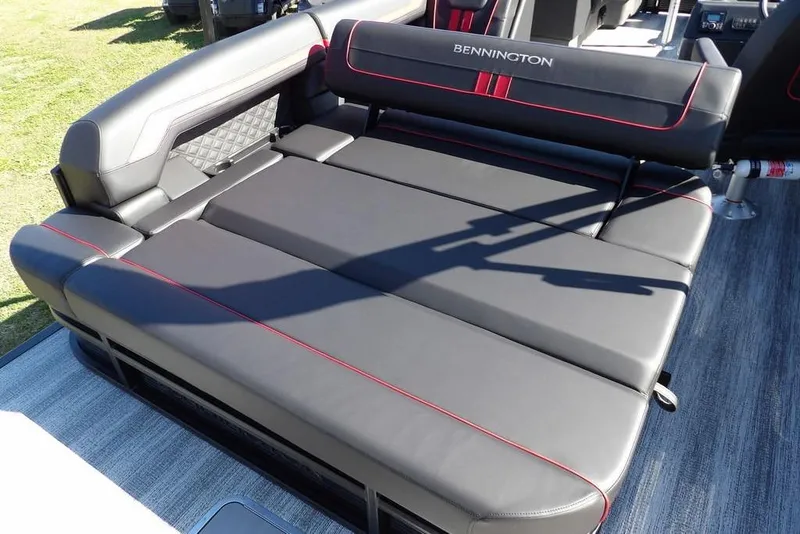 Slide: The Image of 2026 Bennington S Swingback 22 SSB boat seating with black upholstery and red accents. - 31