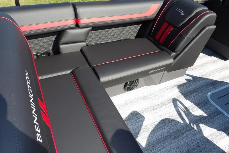 Slide: The Image of 2026 Bennington S Swingback 22 SSB interior with black and red seating design. - 32