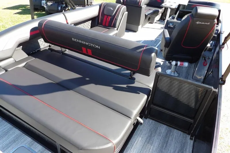 Slide: The Image of 2026 Bennington S Swingback 22 SSB boat interior with sleek black and red seating. - 39