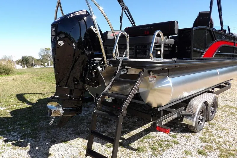 Slide: The Image of 2026 Bennington S Swingback 22 SSB pontoon boat with Mercury outboard motor and trailer. - 41