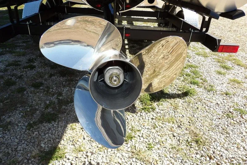Slide: The Image of 2026 Bennington S Swingback 22 SSB propeller, shiny metal blades on gravel surface. - 42