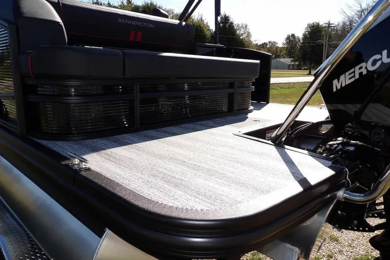 Slide: The Image of 2026 Bennington S Swingback 22 SSB pontoon boat with Mercury engine, rear deck view. - 45