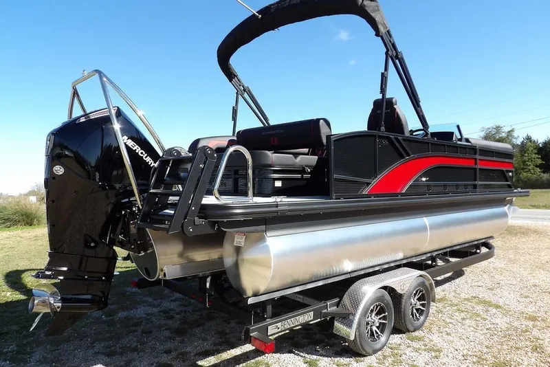 Slide: The Image of 2026 Bennington S Swingback 22 SSB pontoon boat with Mercury engine on trailer. - 8