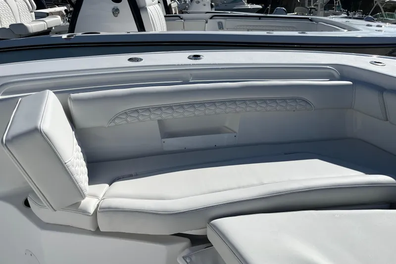 Slide: The Image of 2026 Tidewater 272 CC Adventure boat with luxurious white seating and modern design. - 10