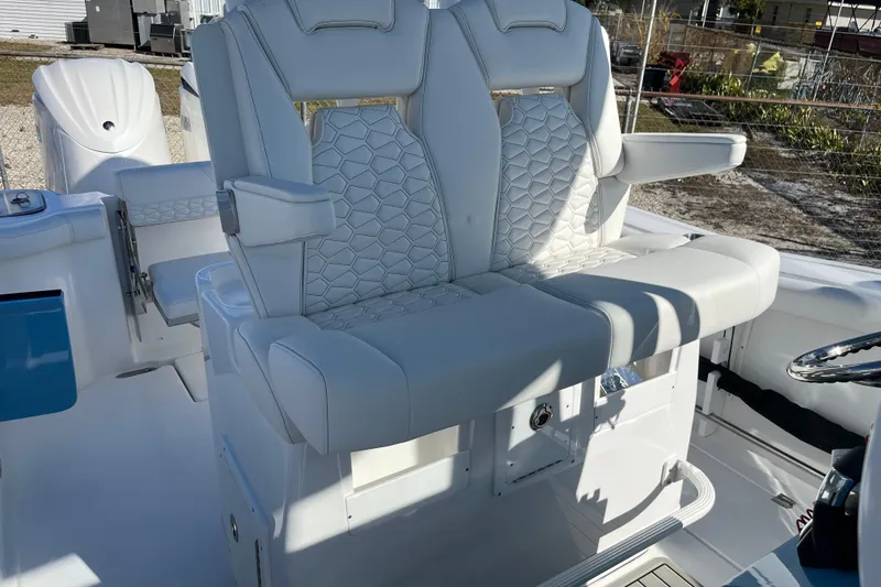 Slide: The Image of 2026 Tidewater 272 CC Adventure boat with luxurious white seating and modern design. - 15