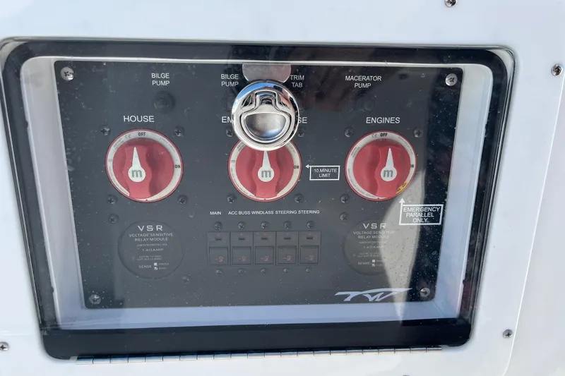 Slide: The Image of Control panel of 2026 Tidewater 272 CC Adventure boat with switches and dials. - 19