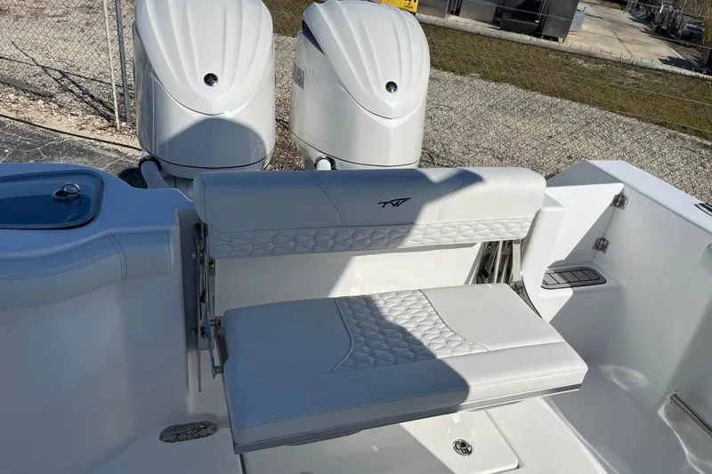 Slide: The Image of 2026 Tidewater 272 CC Adventure boat with dual engines and cushioned seating. - 20