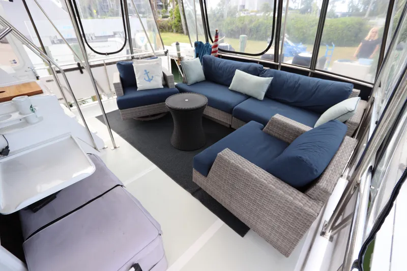 Slide: The Image of Luxurious 2005 DeFever 49 Cockpit Motor Yacht with elegant outdoor seating area. - 23