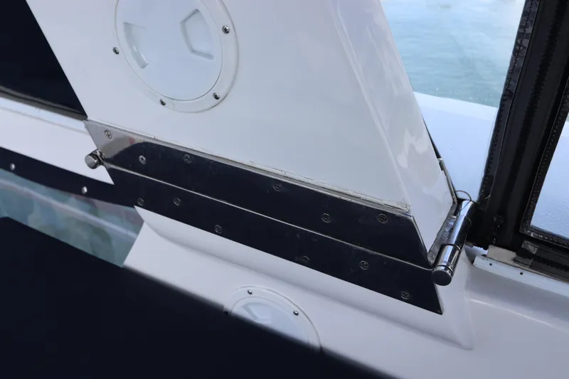 Slide: The Image of Close-up of 2005 DeFever 49 Cockpit Motor Yacht's hinge detail. - 29