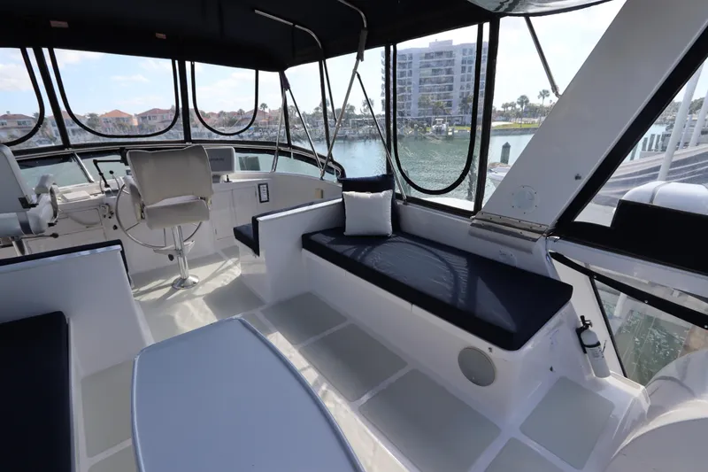 Slide: The Image of Spacious cockpit of 2005 DeFever 49 Cockpit Motor Yacht with seating and helm. - 31