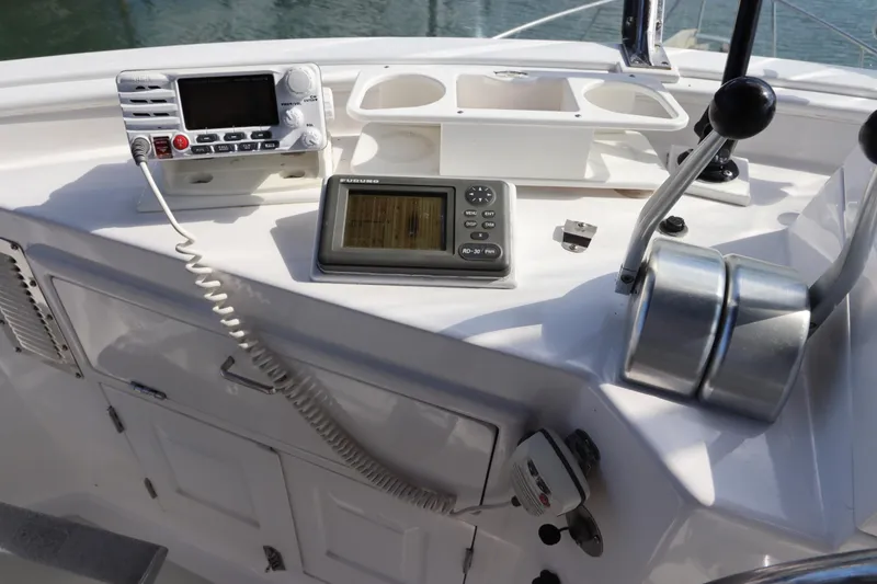 Slide: The Image of Control panel of a 2005 DeFever 49 Cockpit Motor Yacht with navigation equipment. - 37