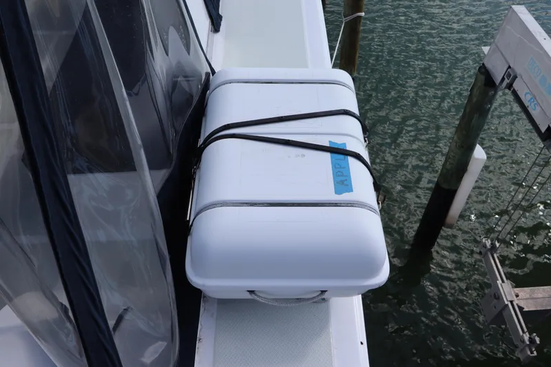 Slide: The Image of White storage box on 2005 DeFever 49 Cockpit Motor Yacht deck by water. - 43