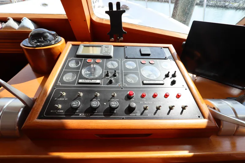 Slide: The Image of Control panel of a 2005 DeFever 49 Cockpit Motor Yacht, featuring navigation instruments. - 62
