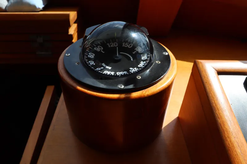 Slide: The Image of Compass on 2005 DeFever 49 Cockpit Motor Yacht, wooden interior detail. - 64