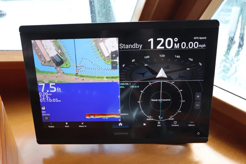 Slide: The Image of Garmin navigation display on 2005 DeFever 49 Cockpit Motor Yacht, showing map and compass. - 66