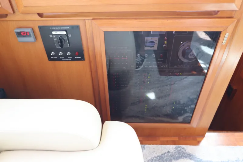 Slide: The Image of Control panel of a 2005 DeFever 49 Cockpit Motor Yacht with wooden finish. - 71