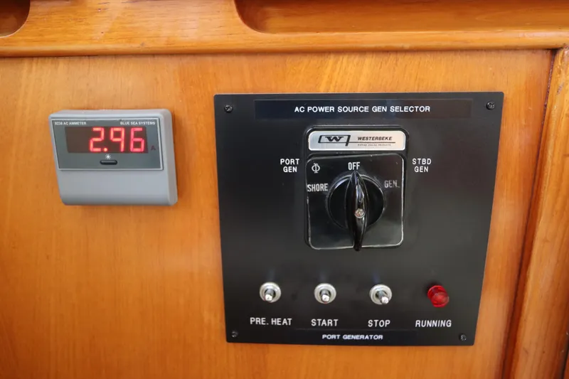 Slide: The Image of Control panel of a 2005 DeFever 49 Cockpit Motor Yacht with ammeter and generator selector. - 73