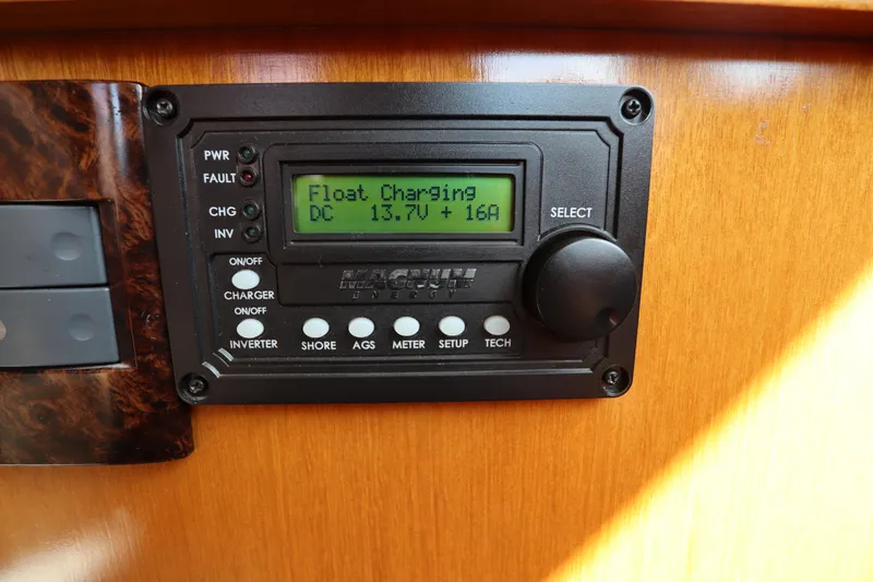 Slide: The Image of Control panel on 2005 DeFever 49 Cockpit Motor Yacht displaying float charging status. - 74
