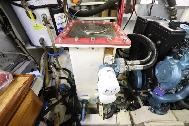 Slide: The Image of Engine room of 2005 DeFever 49 Cockpit Motor Yacht with visible machinery and components. - 91