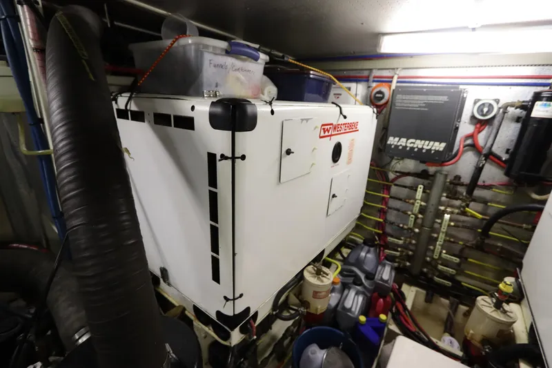 Slide: The Image of Engine room of 2005 DeFever 49 Cockpit Motor Yacht with Westerbeke generator. - 92