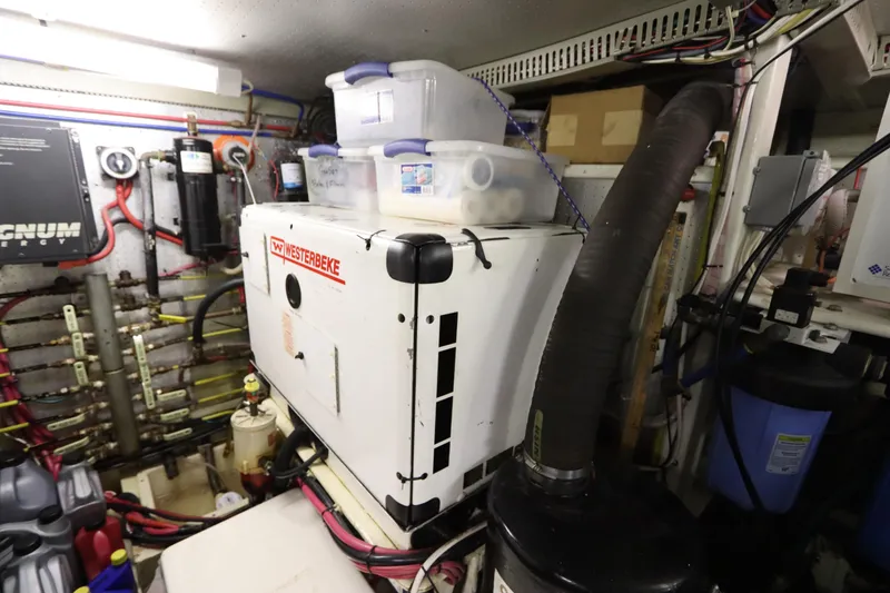 Slide: The Image of Engine room of 2005 DeFever 49 Cockpit Motor Yacht with Westerbeke generator. - 93