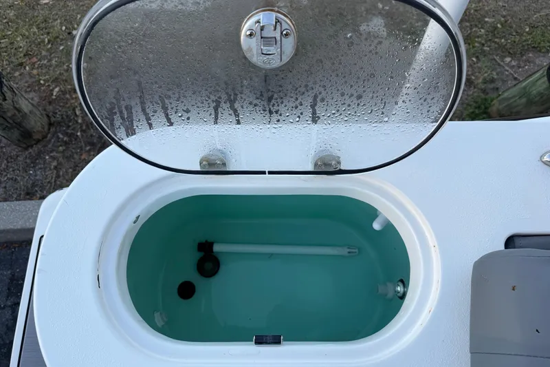 Slide: The Image of Open livewell on 2023 NauticStar 2602 Legacy boat, showcasing interior features. - 18
