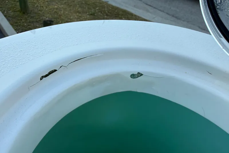 Slide: The Image of Crack on NauticStar 2602 Legacy boat's white surface, 2023 model. - 19