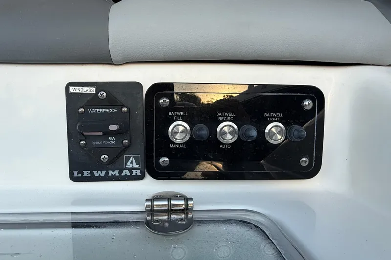 Slide: The Image of Control panel on 2023 NauticStar 2602 Legacy boat with Lewmar windlass switch. - 24