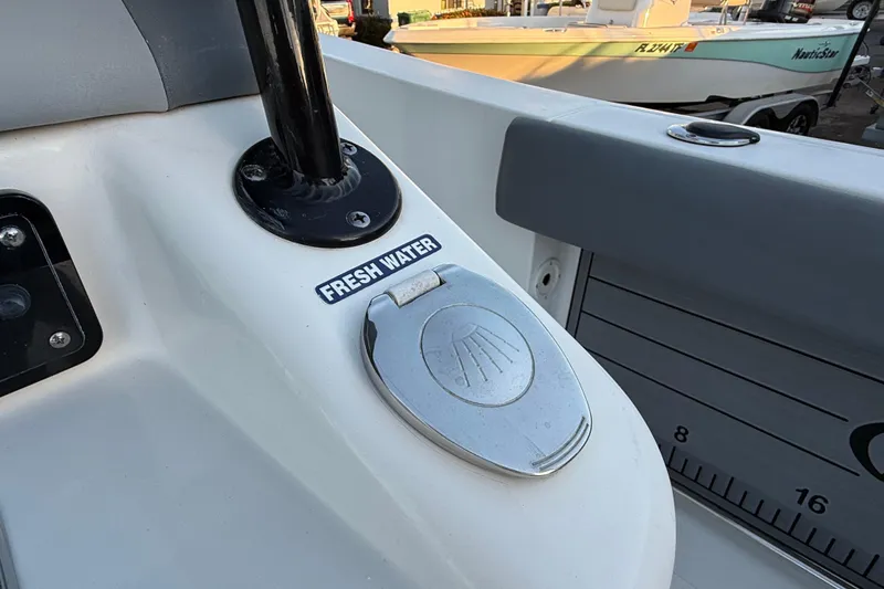 Slide: The Image of 2023 NauticStar 2602 Legacy boat with fresh water access feature. - 25