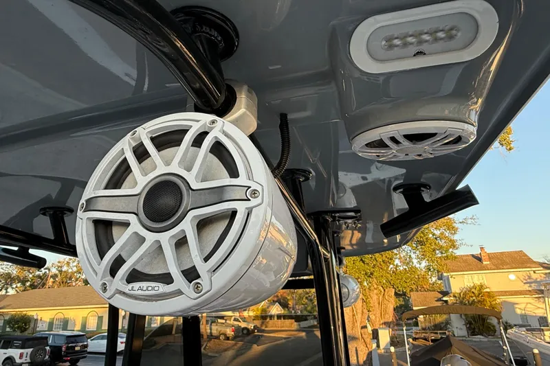 Slide: The Image of 2023 NauticStar 2602 Legacy boat with JL Audio speakers on the deck. - 27