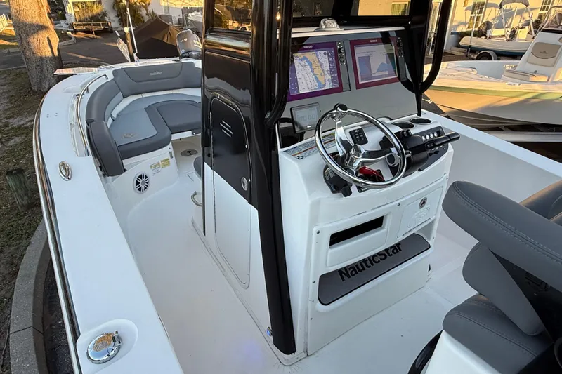 Slide: The Image of 2023 NauticStar 2602 Legacy boat interior with modern helm and seating. - 34
