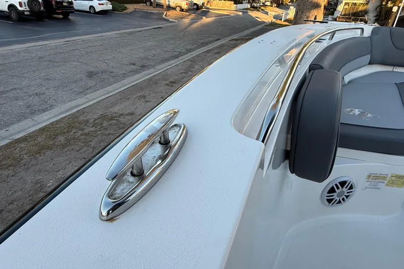 Slide: The Image of 2023 NauticStar 2602 Legacy boat deck with cleat and seating area. - 45