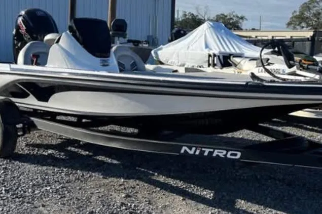 Slide: The Image of 2024 Nitro Z17 boat on trailer, parked outdoors. - 2