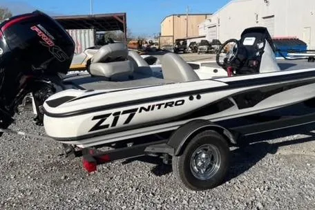 Slide: The Image of 2024 Nitro Z17 boat on trailer, parked outdoors, featuring sleek design and powerful engine. - 5