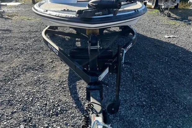 Slide: The Image of 2024 Nitro Z17 boat trailer on gravel lot, front view. - 6