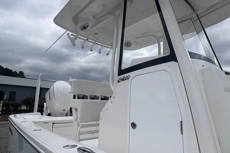 Slide: The Image of 2026 Alera M 25L boat with sleek design and modern features, docked outdoors. - 12