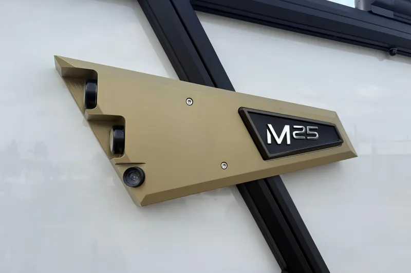 Slide: The Image of 2026 Alera M 25L badge on vehicle exterior, featuring sleek design and modern aesthetics. - 4