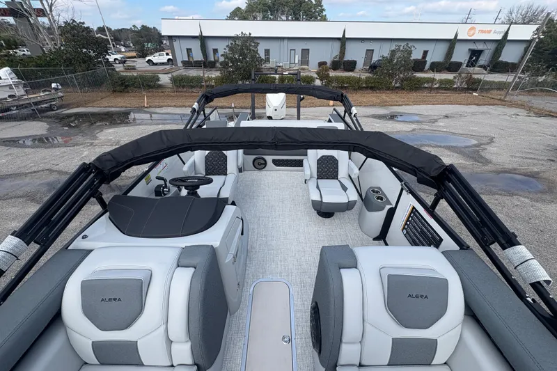 Slide: The Image of 2026 Alera M 25L boat interior with modern seating and steering wheel. - 6
