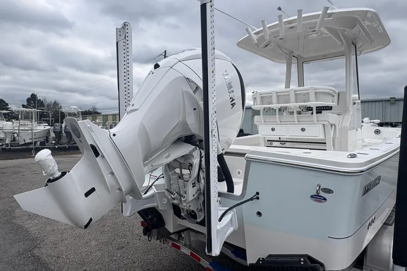 Slide: The Image of 2026 Alera M 25L boat with Yamaha outboard motor, parked outdoors. - 9