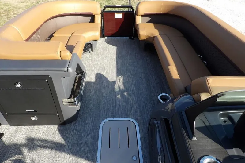 Slide: The Image of 2026 Bennington M L-Bench 22 ML pontoon boat interior with tan seating and storage compartments. - 10