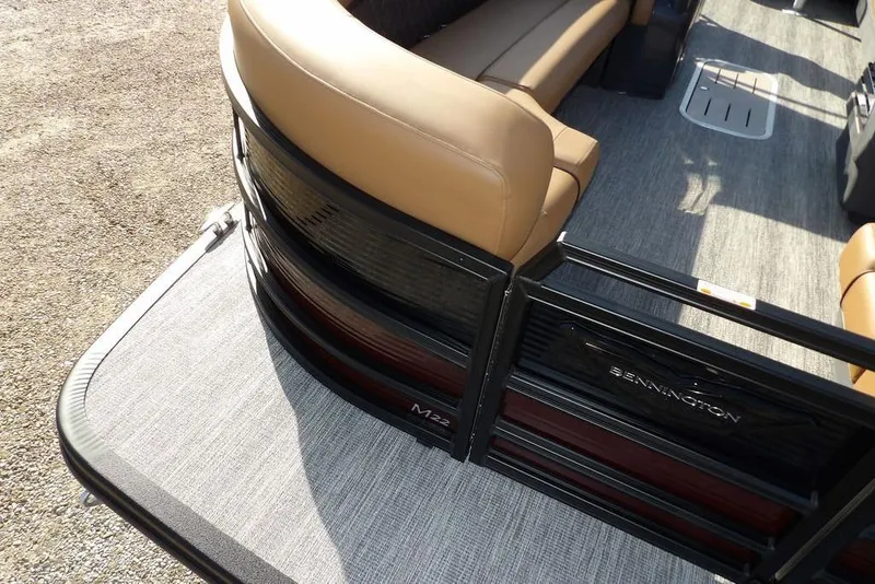 Slide: The Image of 2026 Bennington M L-Bench 22 ML pontoon boat with tan seating and sleek design. - 11