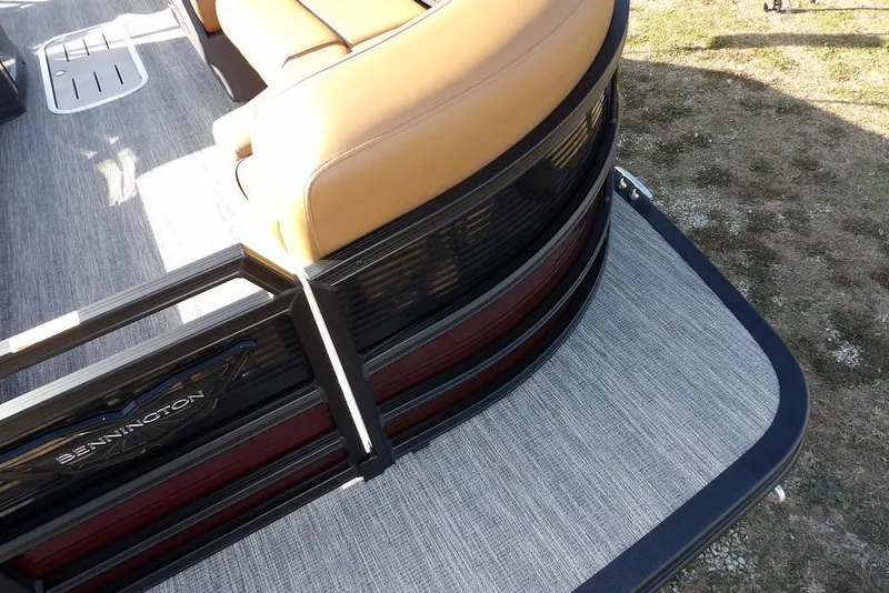 Slide: The Image of 2026 Bennington M L-Bench 22 ML pontoon boat with tan seating and sleek design. - 14