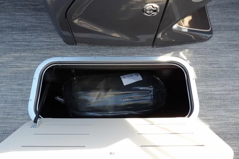 Slide: The Image of Storage compartment in 2026 Bennington M L-Bench 22 ML boat, featuring sleek design and ample space. - 20