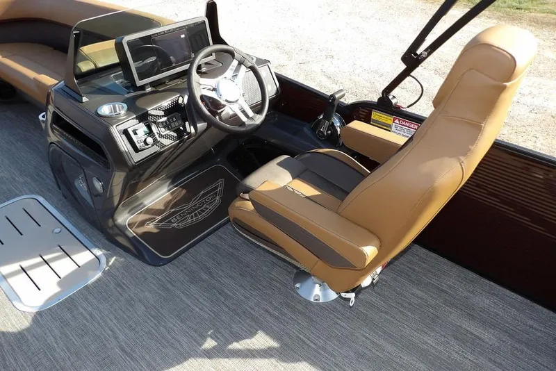 Slide: The Image of 2026 Bennington M L-Bench 22 ML boat interior with steering wheel and seating. - 21