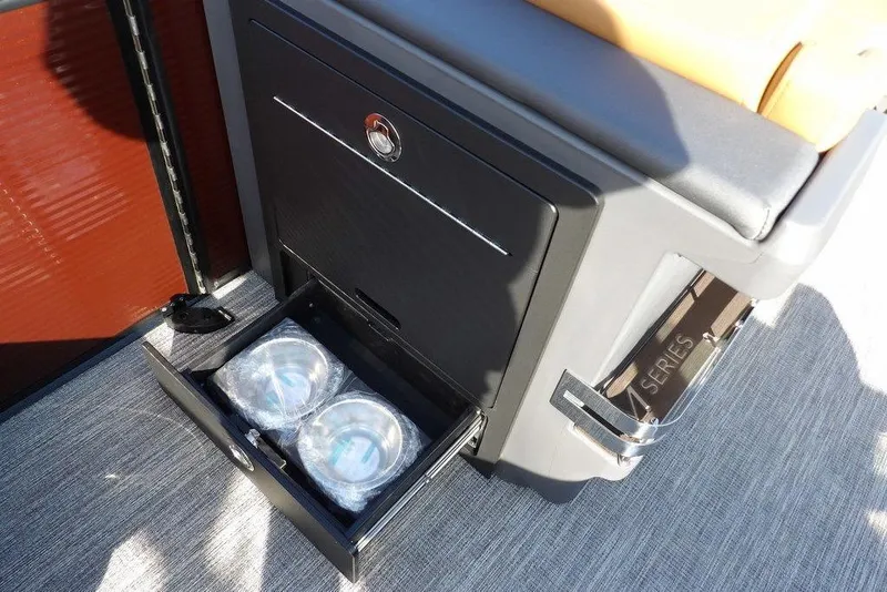 Slide: The Image of 2026 Bennington M L-Bench 22 ML boat interior with storage drawer open. - 22